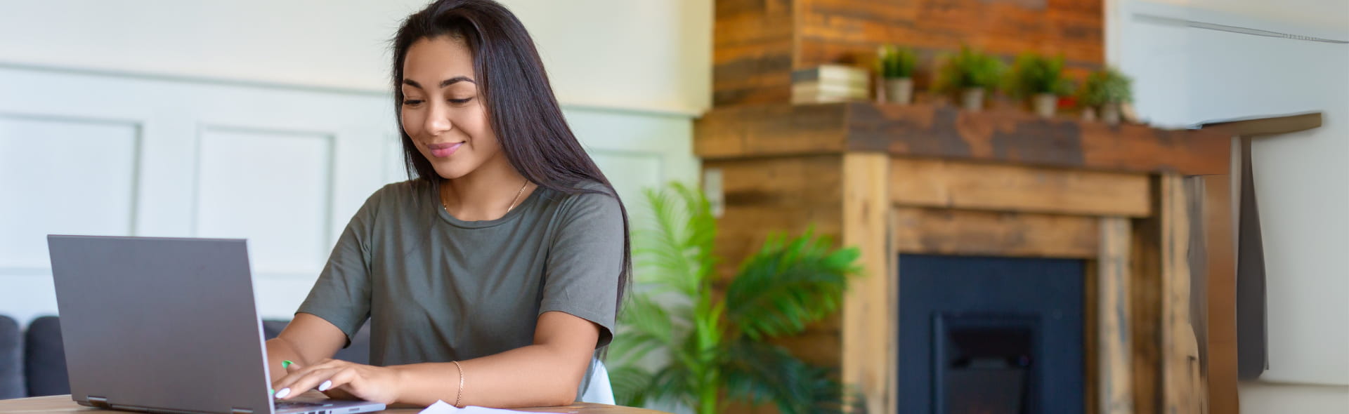 Woman on laptop to pay natural gas bill